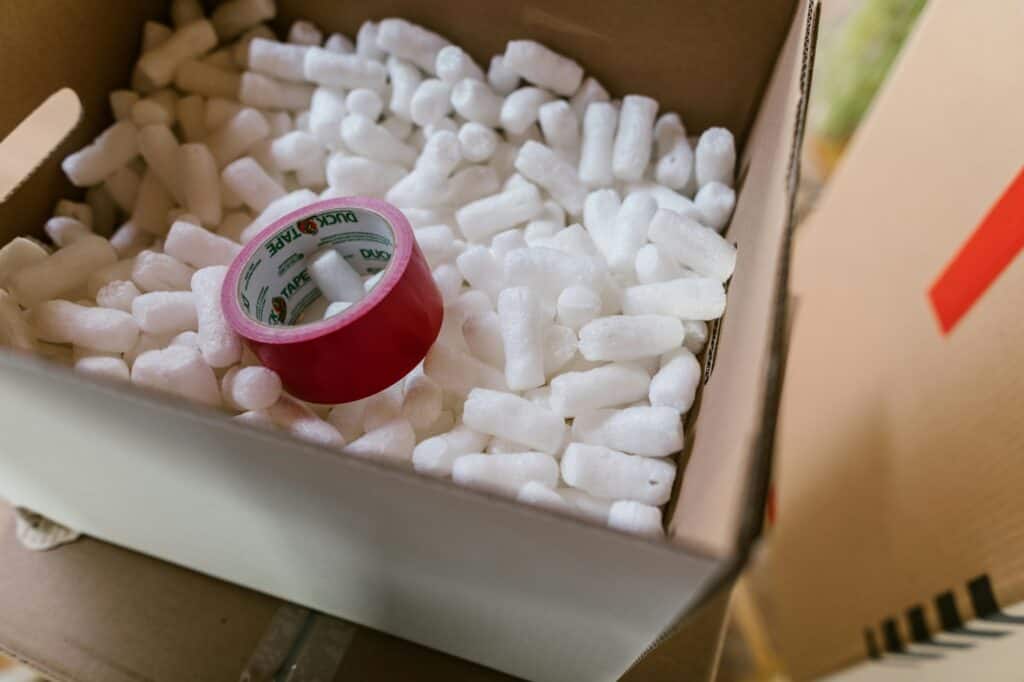 Packing peanuts and tape in the cardboard
