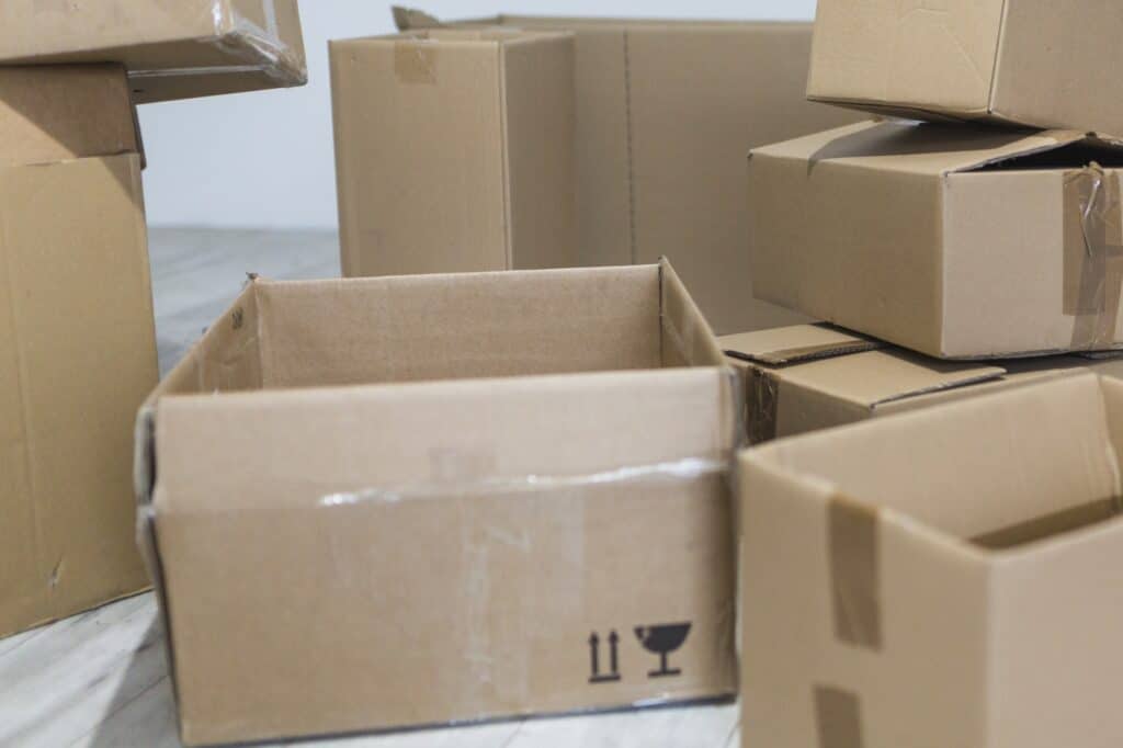 Used moving boxes scattered on the floor - for repurposing